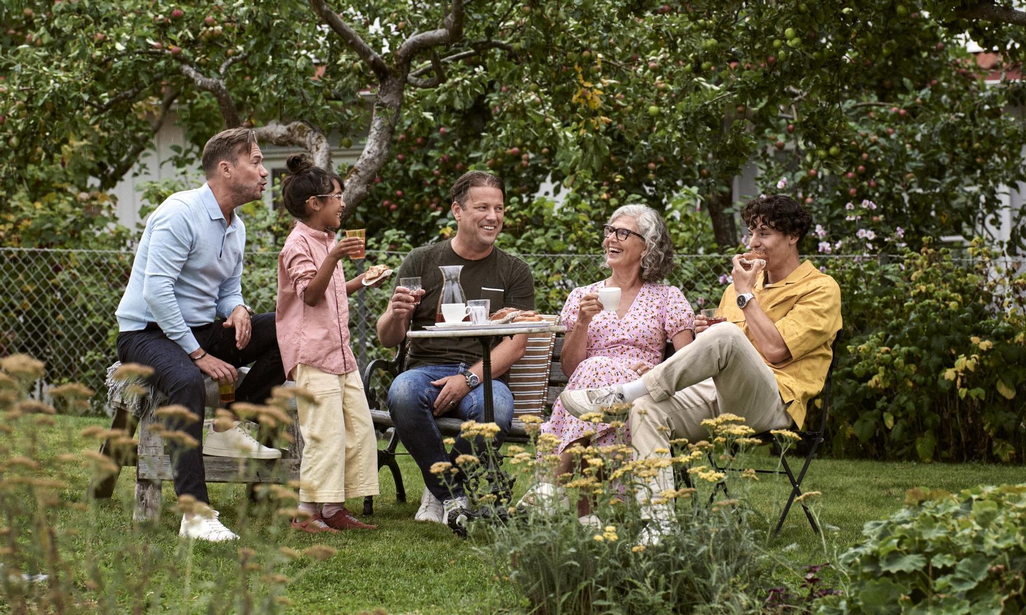Family and friends having a picnic in the garden